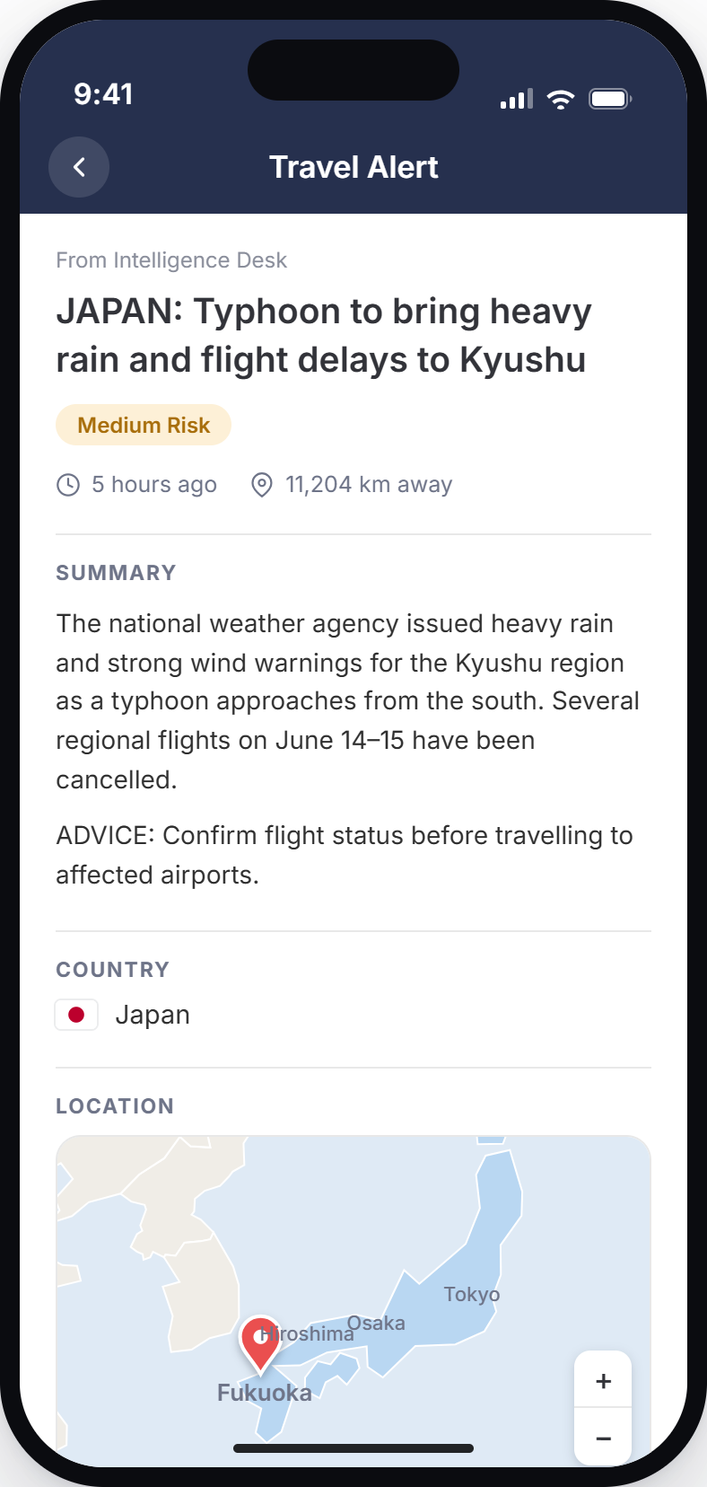 A medium-risk travel alert about typhoon flight delays in Kyushu, Japan, shown in the CI360 traveler app